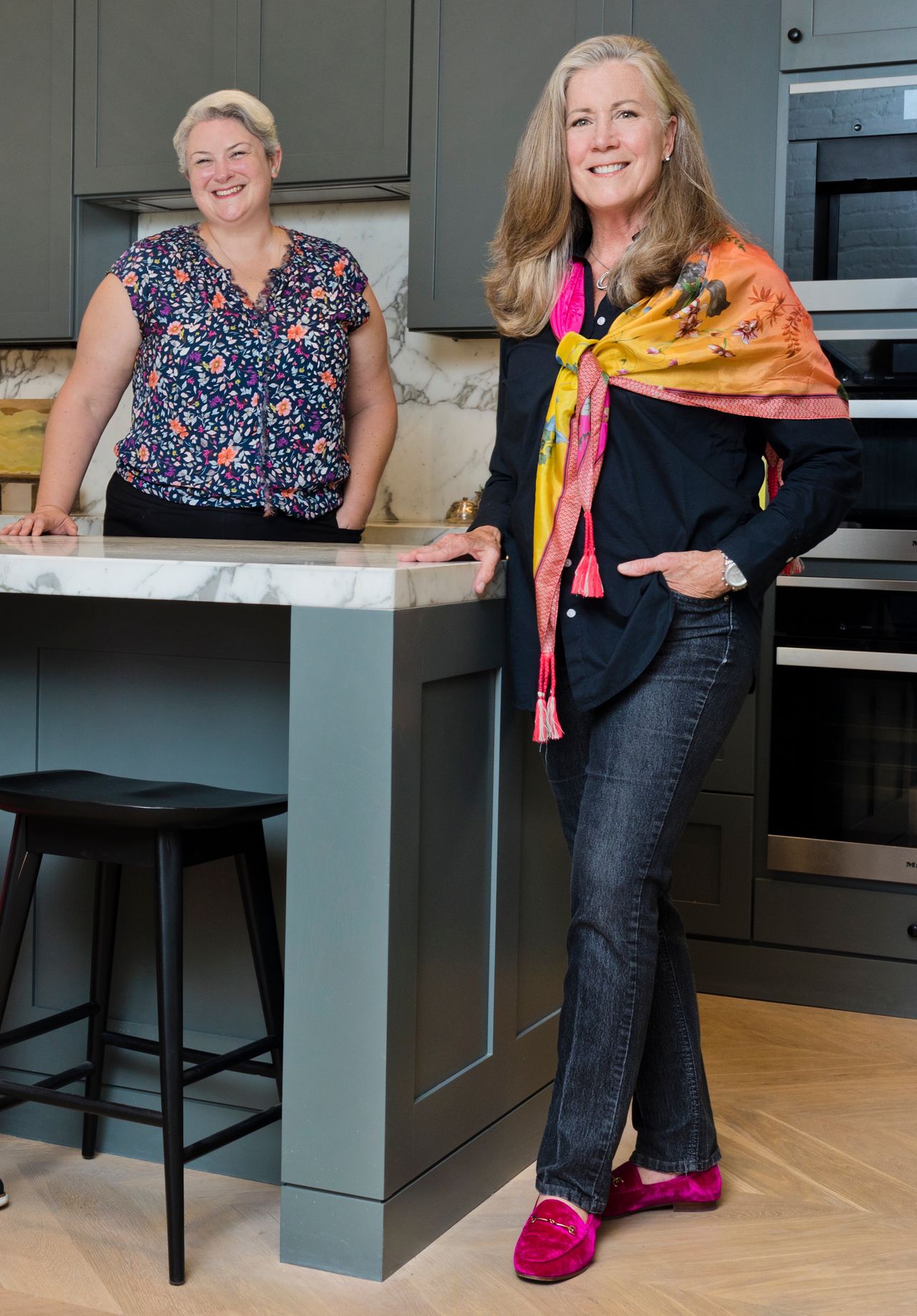 Avery Boyce and Deirdre Jo Fricke standing at a kitchen island